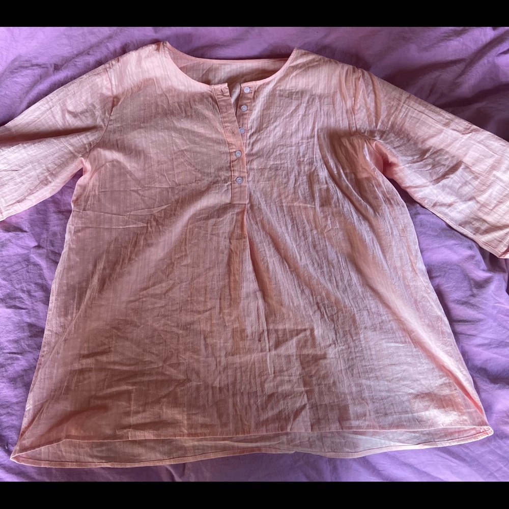 women's long sleeve, pink tunic. size large but fits a variety of sizes.